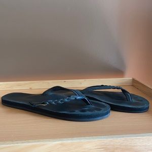 Black Rainbow flip flops